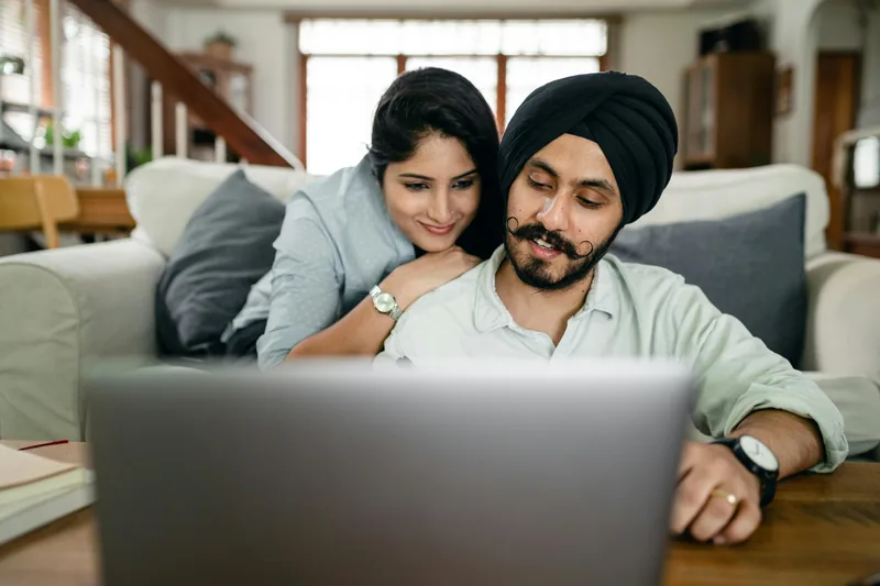 Couple reviewing Bright Money app to decide if it fits their financial situation