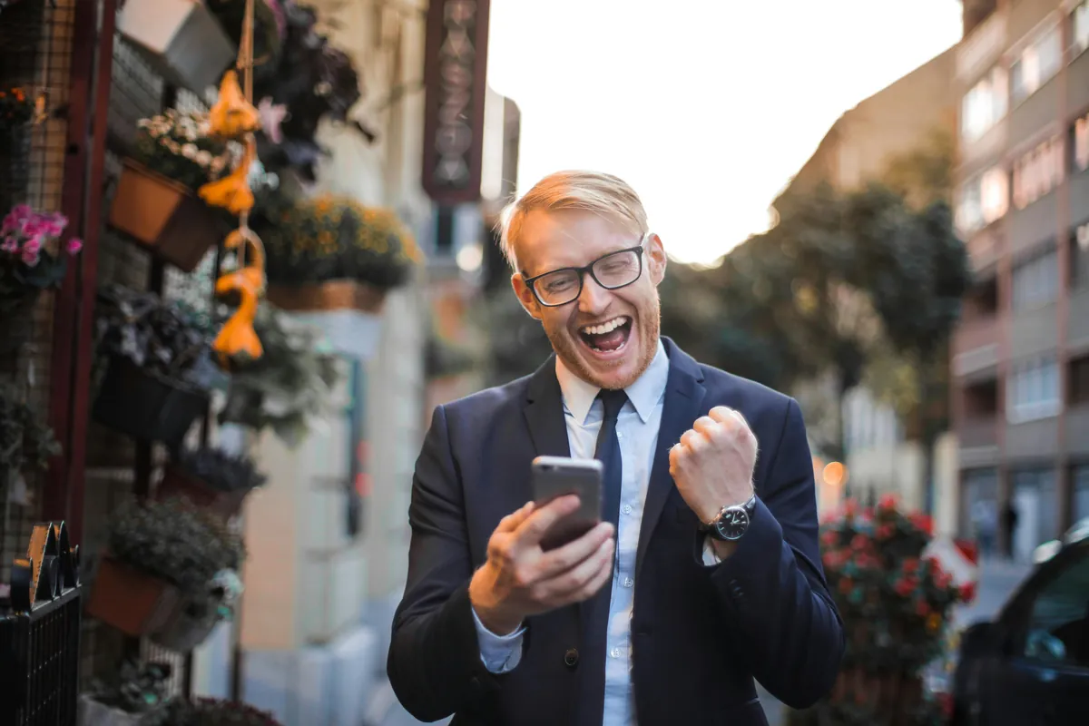A satisfied Bright Money user checking the app